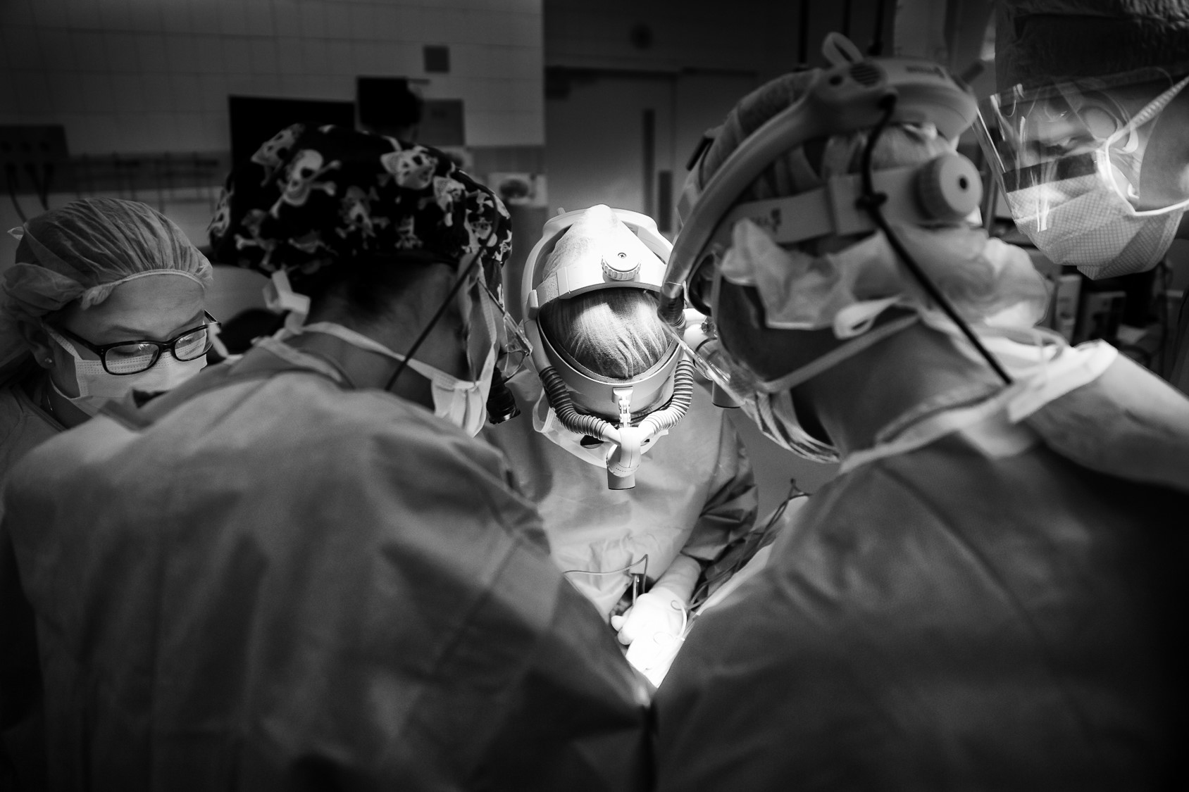 Head and Neck Surgeons performing surgery with a resident